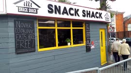 Optimistic cafe owner in Eastbourne