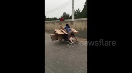 A particularly unsafe way to ride a motorbike