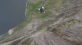 4 person wingsuit tracking suit BASE jump from Kjerag Norway