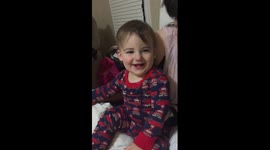 baby can't stop laughing at boobies