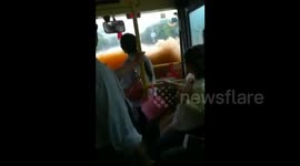 Bus driver ploughs along flooded road as if he's driving a speedboat