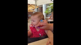 Funny Baby Face Eating Sour Strawberries