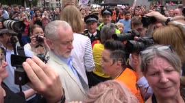 Jeremy Corbyn jostled by fans, media and protester as he arrives at Tories Out demo