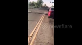 Newsflare Edit - Man jumps out of car to close woman's open petrol cap