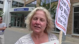 Paula Mitchell from the Socialist Party protest Low Pay, No Way