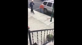 Man and woman engage in heated war of words on sidewalk
