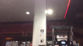 Thousands of moths invade gas station
