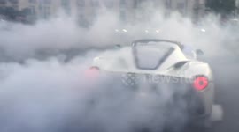 Ferrari driver pulls amazing doughnuts near crowd at Gumball 3000