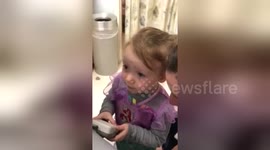 Girl, 2, is delighted to hear her baby sister's heartbeat