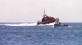 Sennen Cove Lifeboat towing yacht to harbour
