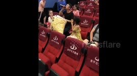 Man brings a huge bag of popcorn into cinema