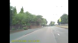 Car trying to overtake bicycle on a blind bend
