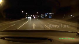 Car driving wrong way by night