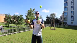Man shows off impressive juggling skills with tennis balls and can