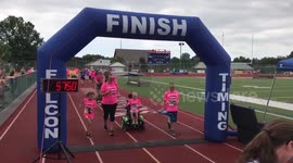 Little boy with rare condition asked parents to complete a 5K. This is the moment he crossed the finish line