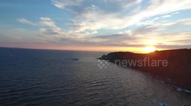 North Atlantic Ocean: Icebergs, sunset and full moon, Jul 07, 2017