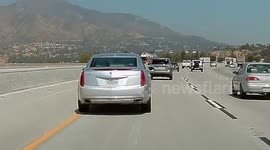 Erratic Driver Crashes Into Concrete Barrier