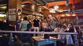 Flashmob choir takes over restaurant for wedding proposal