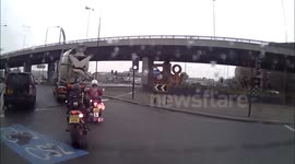 UK driver complaining about dangerous roundabout hits biker