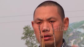 Kung fu master carries buckets with eyelids