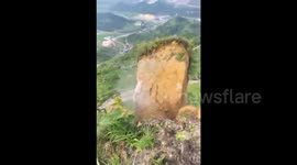 Huge section of mountainside collapses after heavy rain