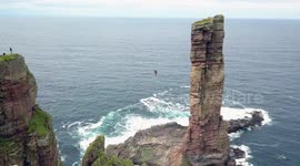 Daredevil Alexander Schulz performs first high wire walk to sea stack in Scotland