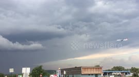 Austrian Bombardier Q400 landing in Vienna pretty close to a scary tornado