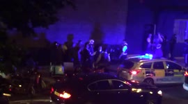 Police attend the scene of an 'acid attack' in Hackney