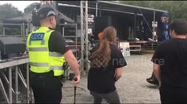 Policeman rocks out to heavy metal band at UK festival