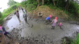 Team Work By Kids Stuck In Mud