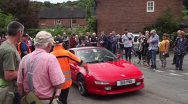 Drivers in classic cars race up UK hill