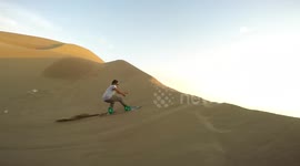 Daredevils go sandboarding across giant dunes in Chile