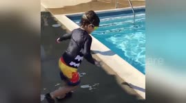 Newsflare Edit - Kid jumping into swimming pool- slo mo