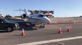 Jet aircraft rolls through fence at US airport