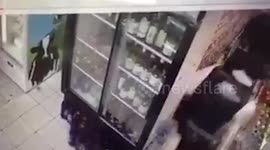 CCTV SHOW'S MAN DIES AFTER BEING CHASED BY POLICE INTO A SHOP IN EAST LONDON