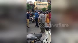 Newsflare Edit - 2 local men bullying a foreign man on the street for car crash