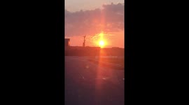 Ship coming in at sunrise