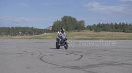 Motorcycle passenger hits the ground hard after wheelie landing