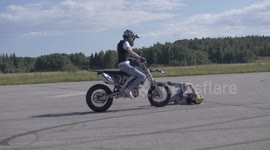 Newsflare Edit - Motorcycle passenger hits the ground hard after wheelie landing