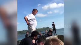 Tombstoning stunt goes horribly wrong when man lands on his back