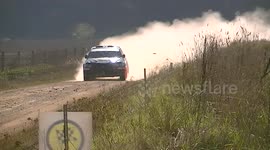 Rally spectator runs for his life as car crashes into barrier