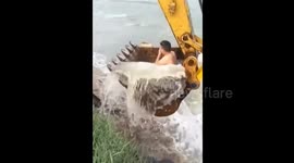 Worker uses digger to shower in river