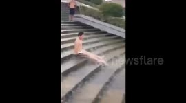 Boy uses stairs as waterslide in China