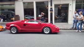 Posh kids with Lamborghini & Ferrari outside a hotel in Green Park, London, UK
