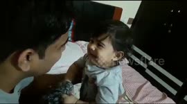 Baby breaks into tears after father shaves beard