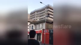 Newsflare Edit - Drunk Guy Climbs A Street Light and Hangs Off It To Impress Friends