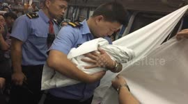 Commuters help woman give birth on busy train