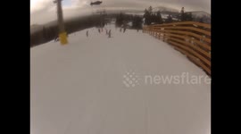 Snowboarder FAILS and crashes into a little girl