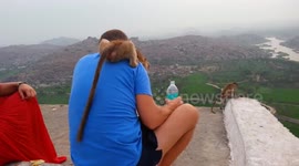Monkeys interact and have fun with people at Monkey temple, Hampi, India