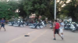 Cambodian street footballers play kickabout with a hacky sack